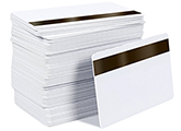 OrsonLew.com photo of a stack of blank white PVC cards with a slot punch on the short side that may be used for vertical ID badges